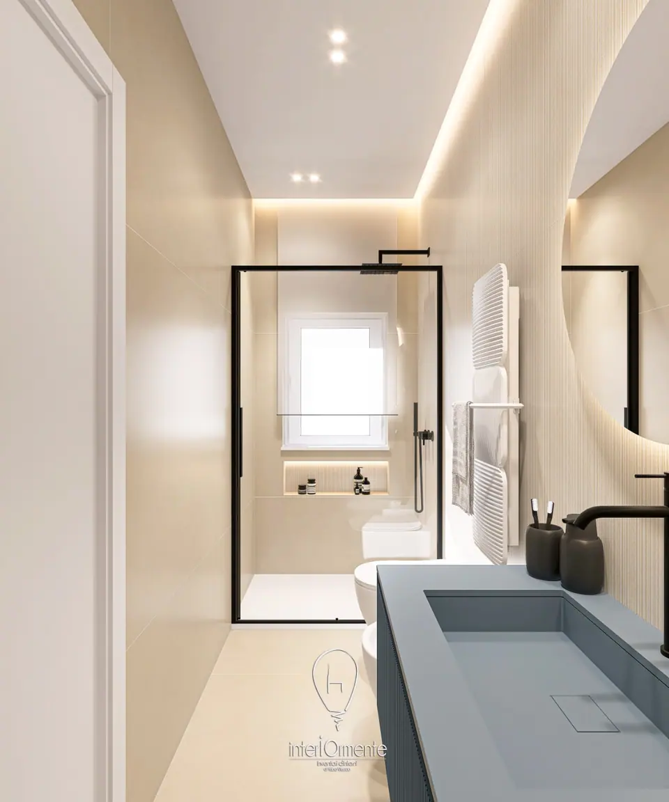 Bagno beige visto dalla porta, con lavabo blu in primo piano e doccia con profili neri sotto la finestra