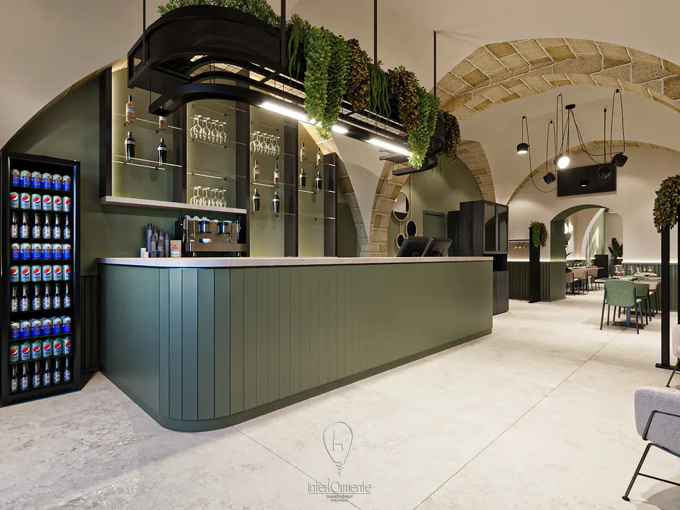 Bar con bancone verde cannettato, frigorifero per bibite, struttura con piante sospese e archi in pietra