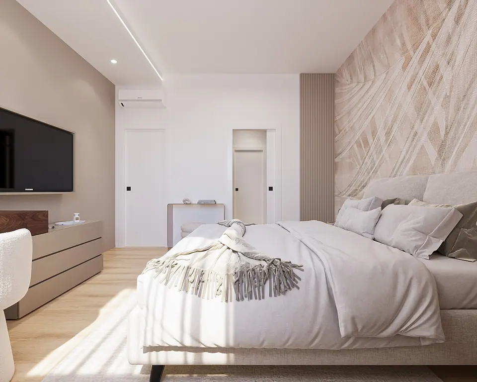 Camera matrimoniale beige con letto imbottito e armadio a filo muro