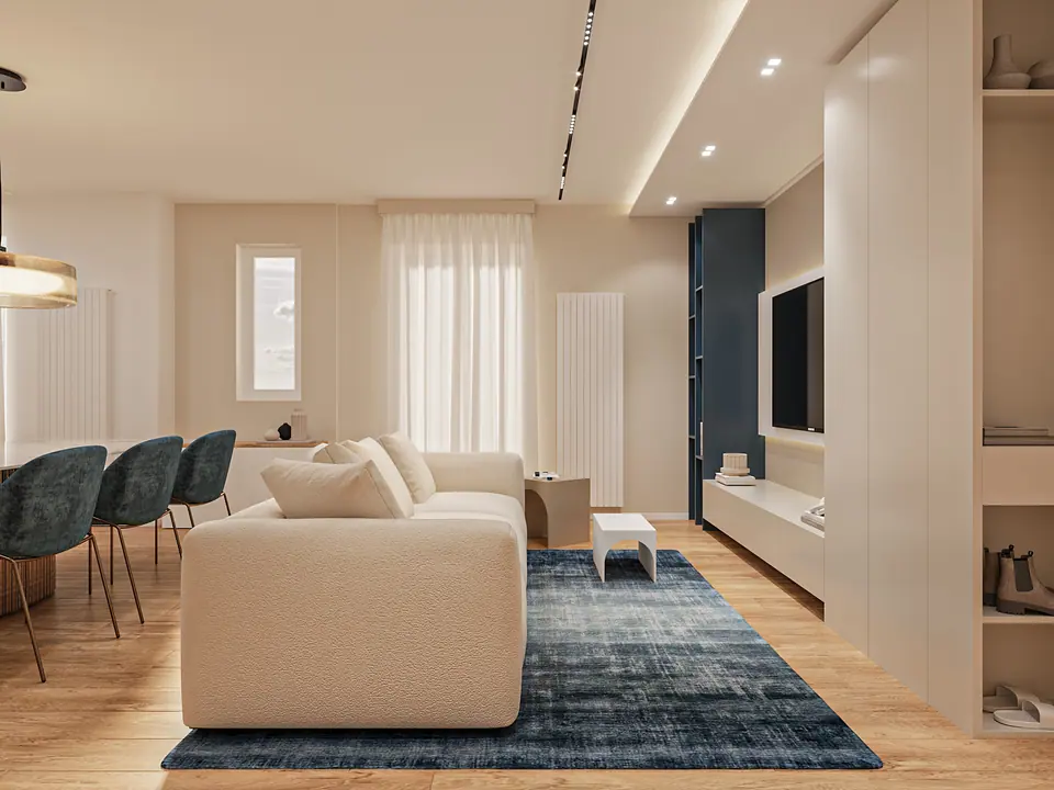 Salotto con divano beige, tappeto blu e parete attrezzata con televisione