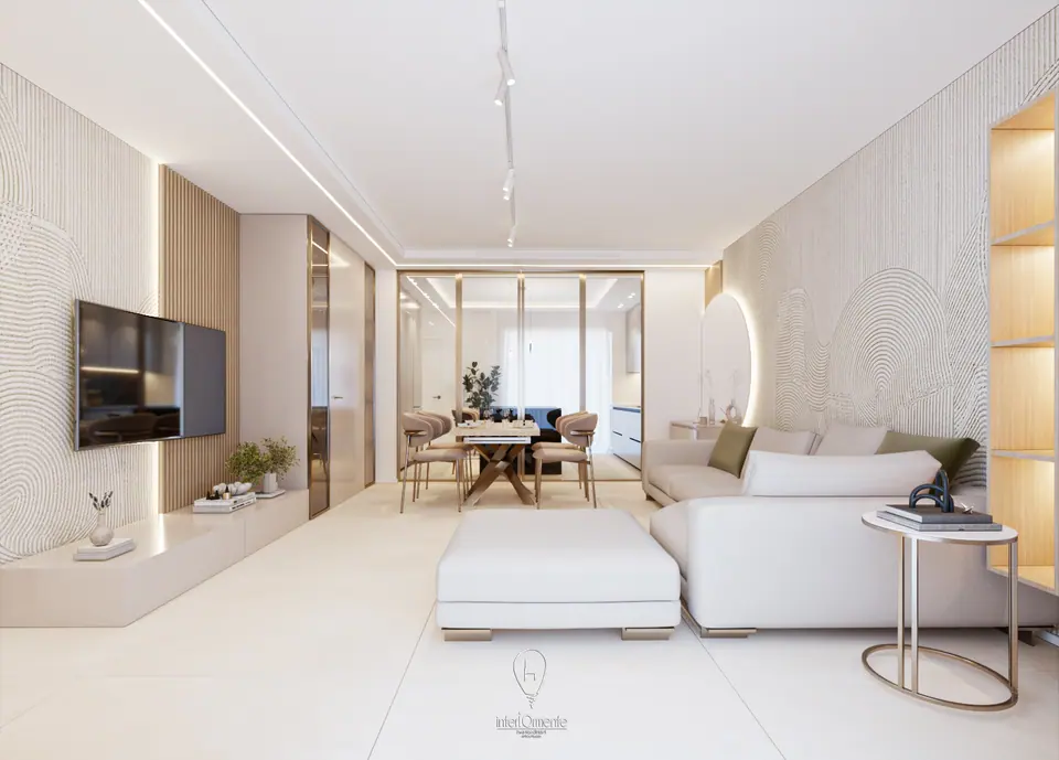 Ambiente con cornice luminosa a soffitto, seduta bianca e zona pranzo